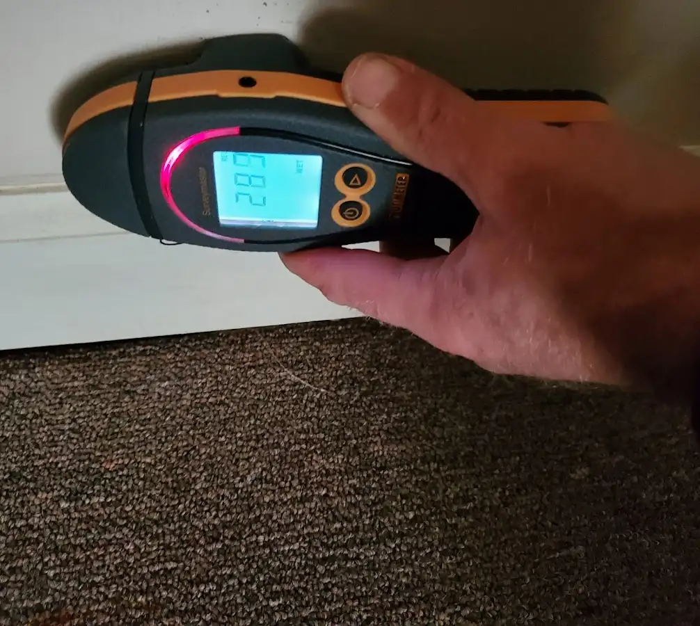 Moisture detection at baseboard during Storm Damage Restoration in West Valley City